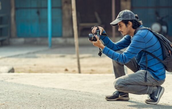 Young Indian photographer taking pictures on streets Dehradun