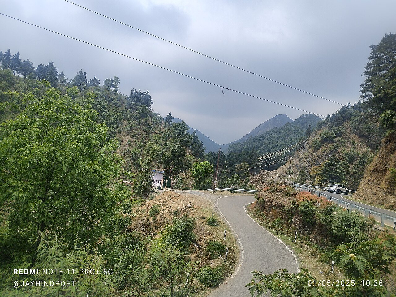 Mussoorie Road Dehradun real estate corridor with hill views